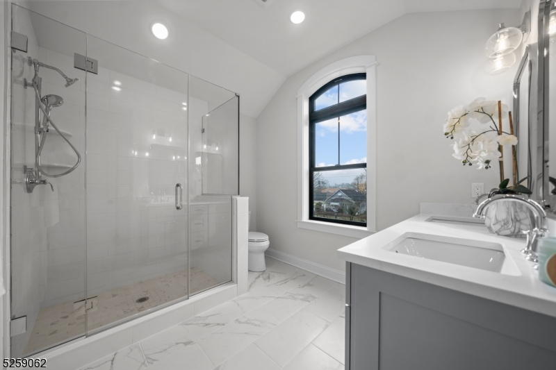 147 Center Avenue, Unit 17 Old Tappan, NJ 07675 - Photo 27 of 48 a bathroom with a sink a toilet and shower