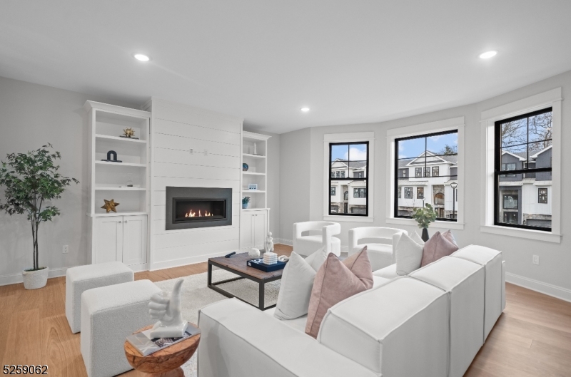 147 Center Avenue, Unit 17 Old Tappan, NJ 07675 - Photo 3 of 48 a living room with furniture and a fireplace