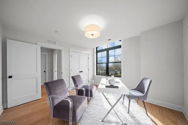 a view of a livingroom with furniture and wooden floor