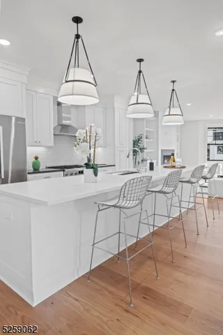 a living room with furniture a table and chairs