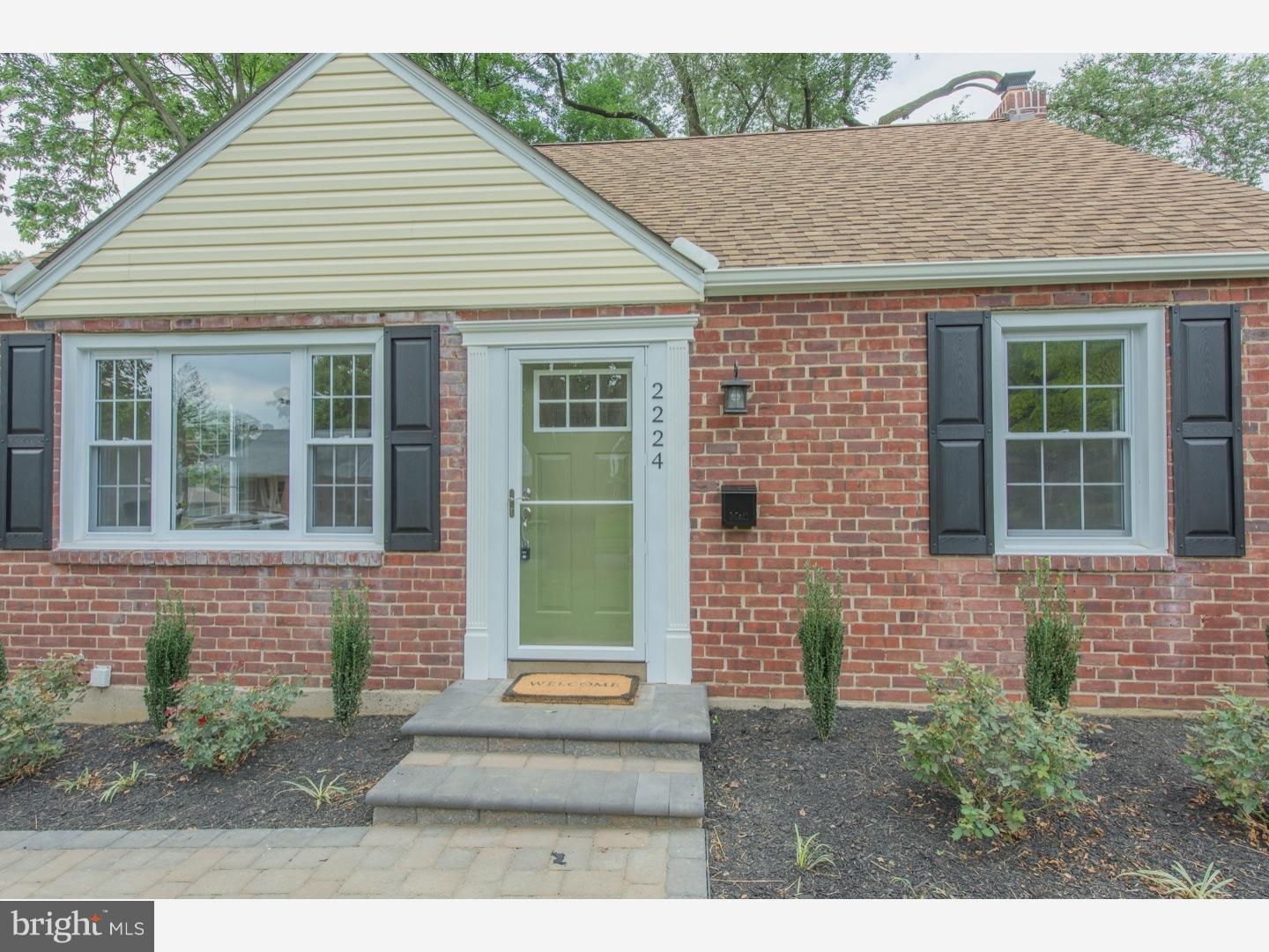 2224 Avon Road Ardmore, PA 19003 - Photo 2 of 23 a front view of a house with a garden