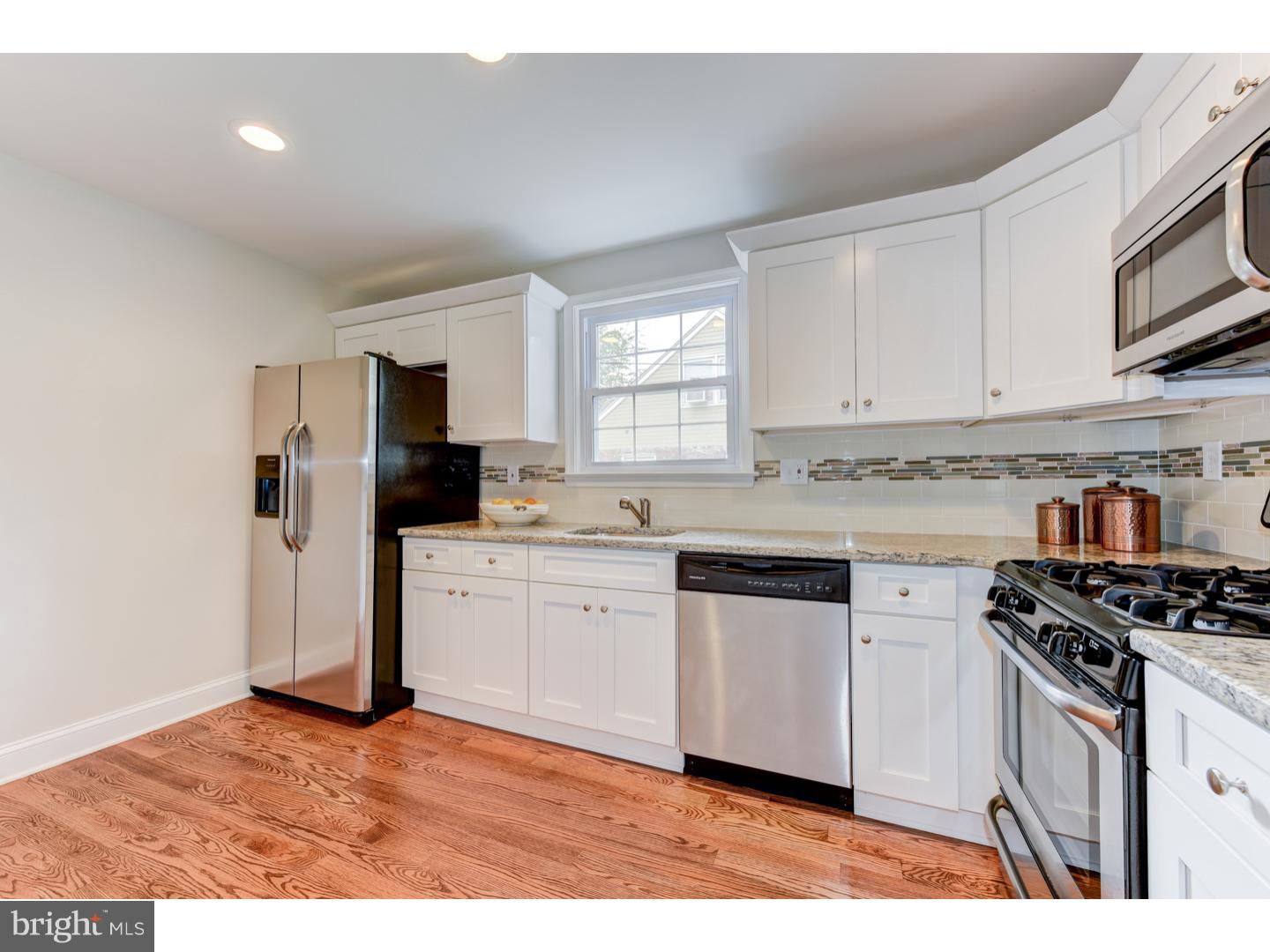 2224 Avon Road Ardmore, PA 19003 - Photo 11 of 23 a kitchen with granite countertop a sink cabinets stainless steel appliances and a window