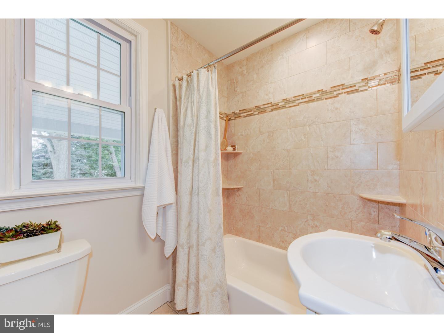 2224 Avon Road Ardmore, PA 19003 - Photo 13 of 23 a bathroom with a sink a toilet and shower