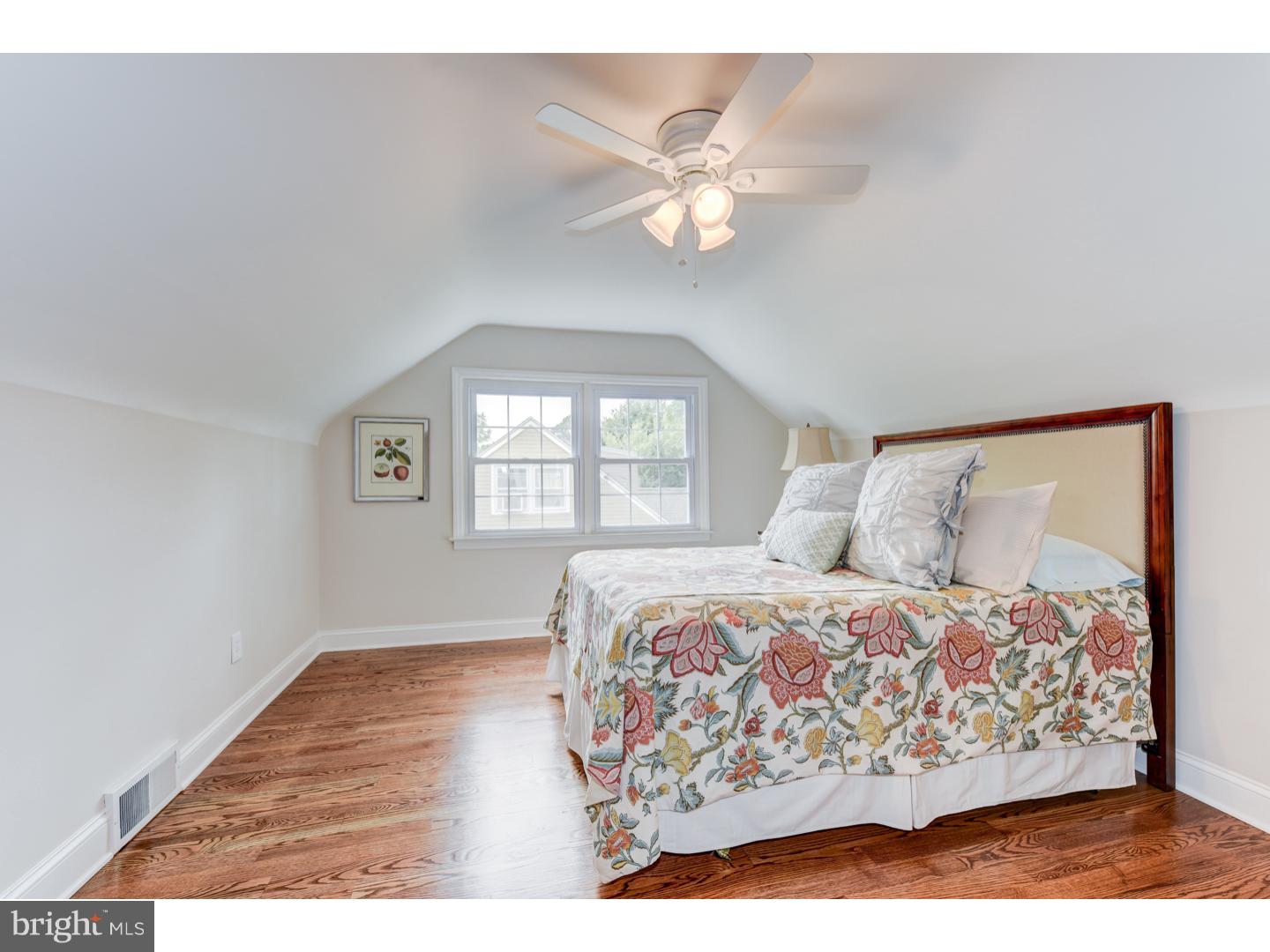 2224 Avon Road Ardmore, PA 19003 - Photo 17 of 23 a bedroom with a bed and wooden floor