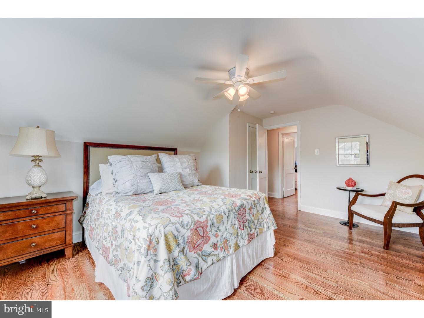 2224 Avon Road Ardmore, PA 19003 - Photo 18 of 23 a bedroom with a bed and a chandelier