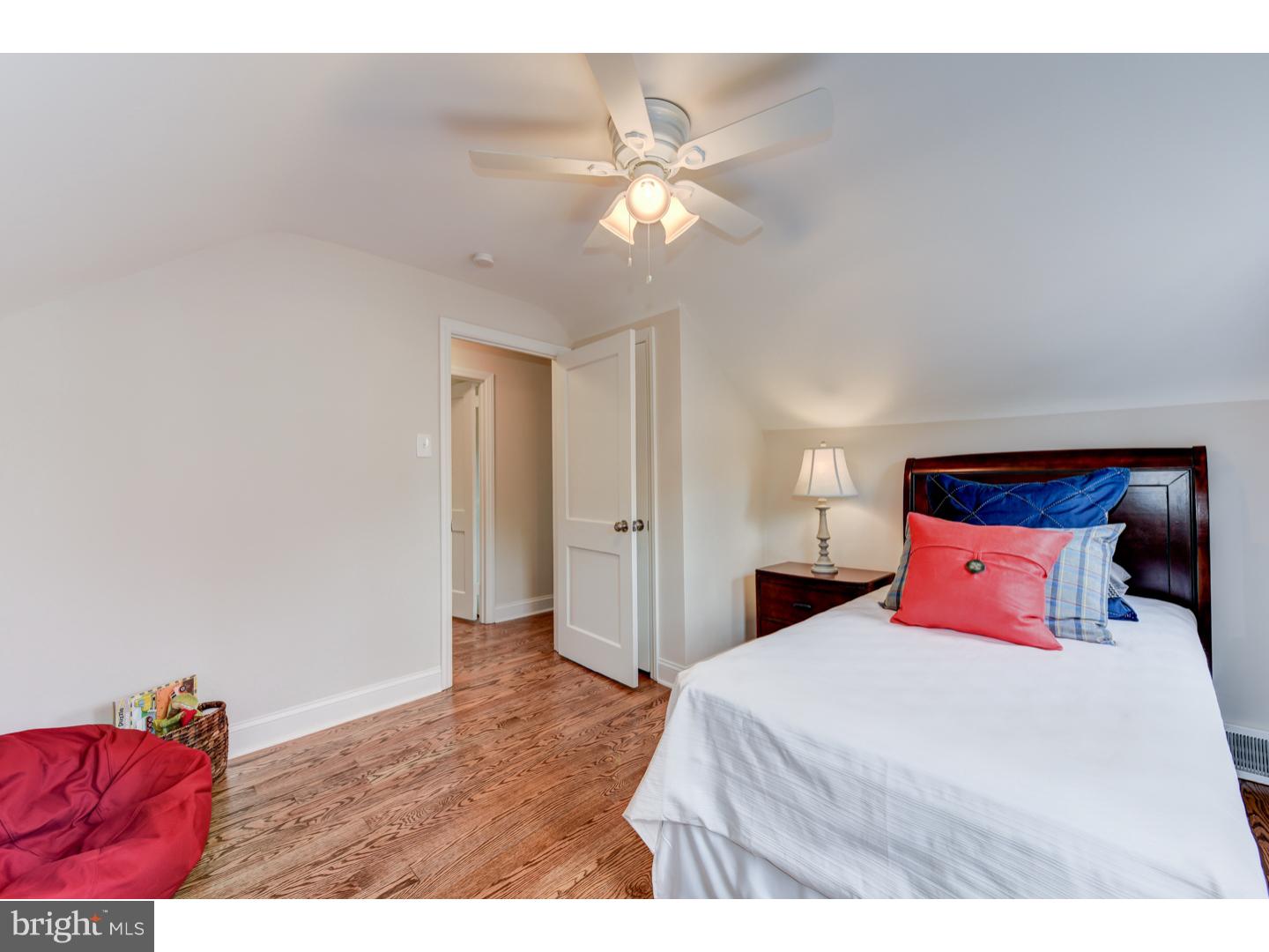 2224 Avon Road Ardmore, PA 19003 - Photo 21 of 23 a bedroom with a bed and a chandelier