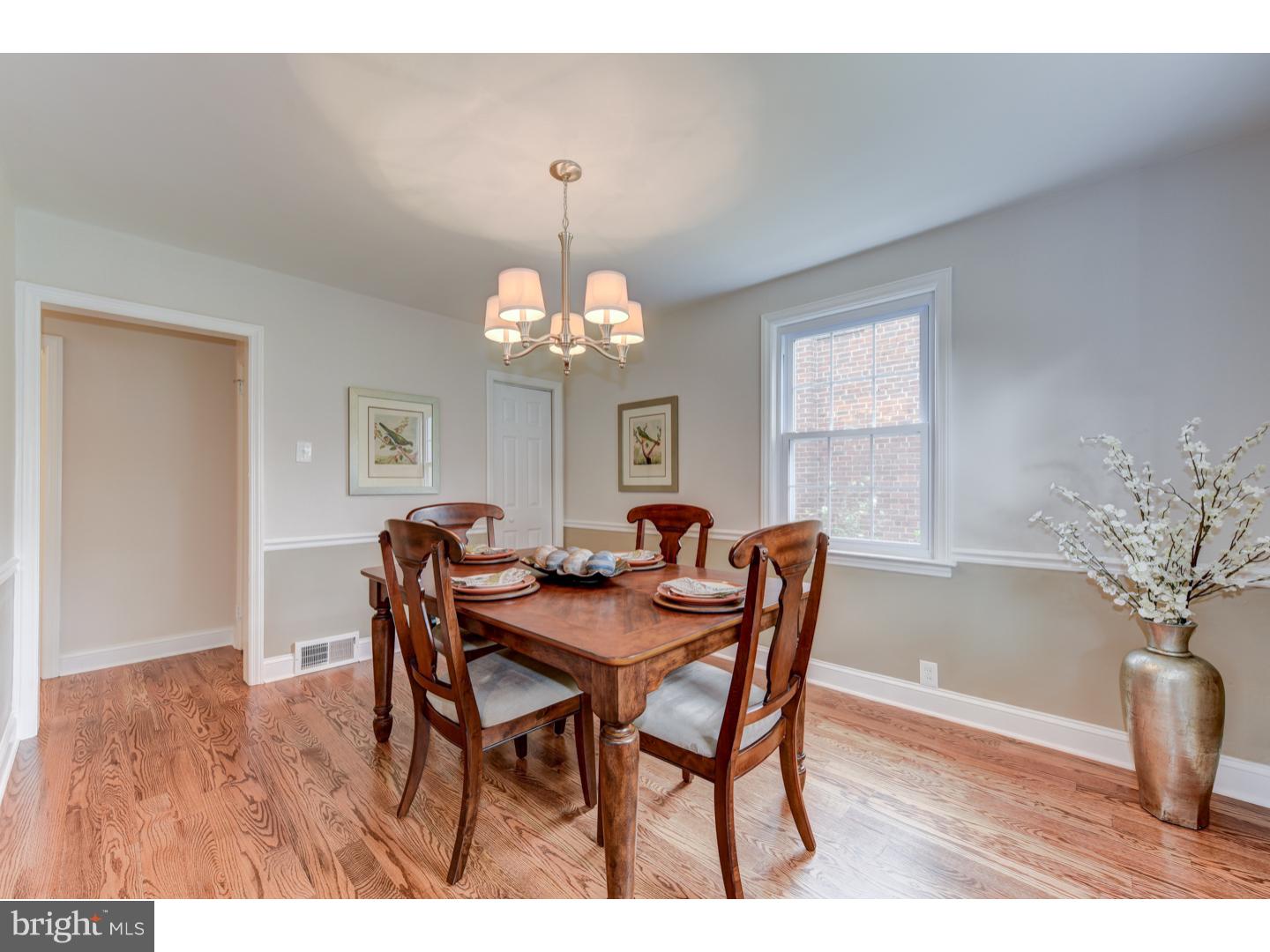 2224 Avon Road Ardmore, PA 19003 - Photo 6 of 23 a view of a dining room with furniture a chandelier and wooden floor
