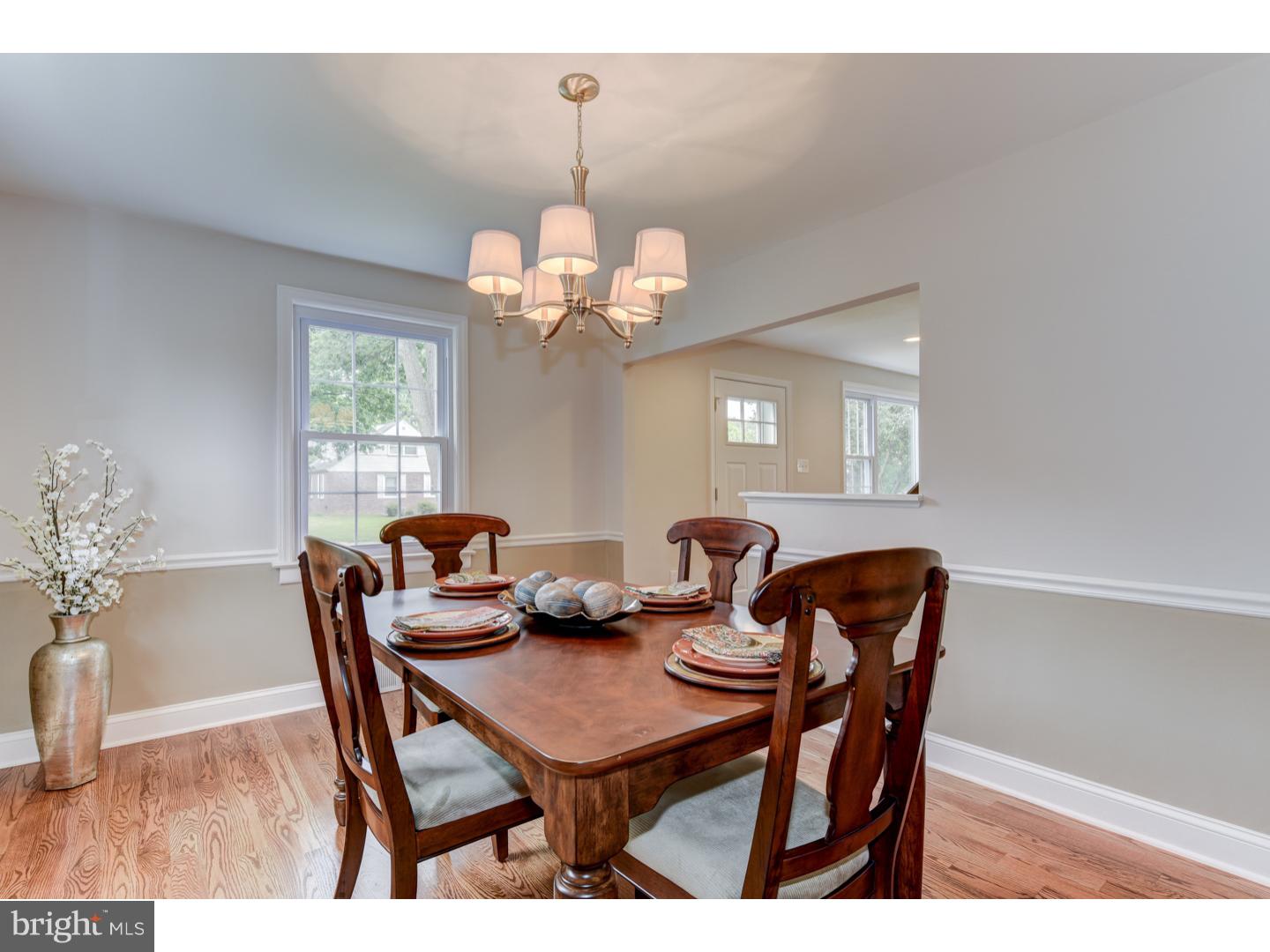 2224 Avon Road Ardmore, PA 19003 - Photo 8 of 23 a dining room with furniture a chandelier and wooden floor