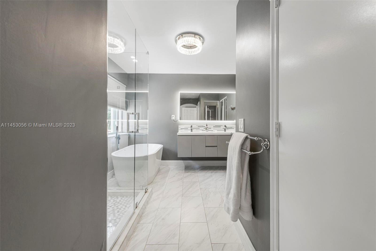 4175 Tree Top Road Cooper City, FL 33026 - Photo 20 of 39 a bathroom with a sink toilet and tub