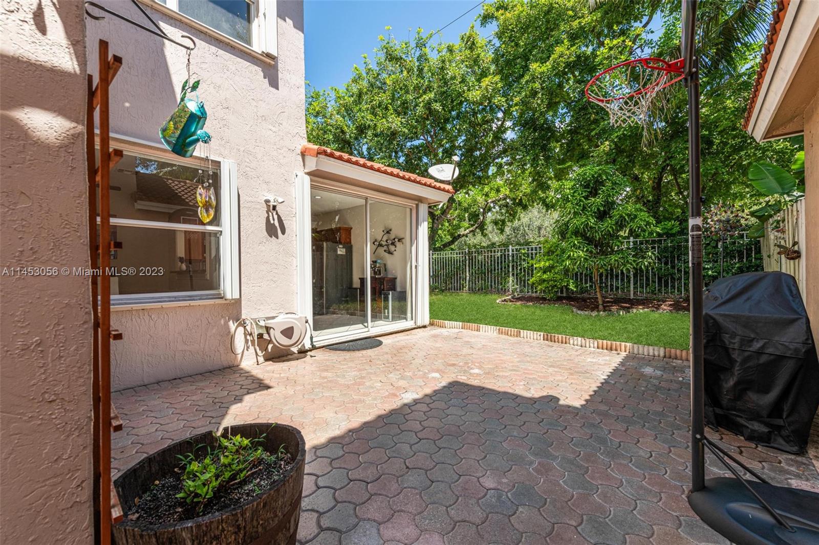 4175 Tree Top Road Cooper City, FL 33026 - Photo 27 of 39 a view of a house with backyard and garden