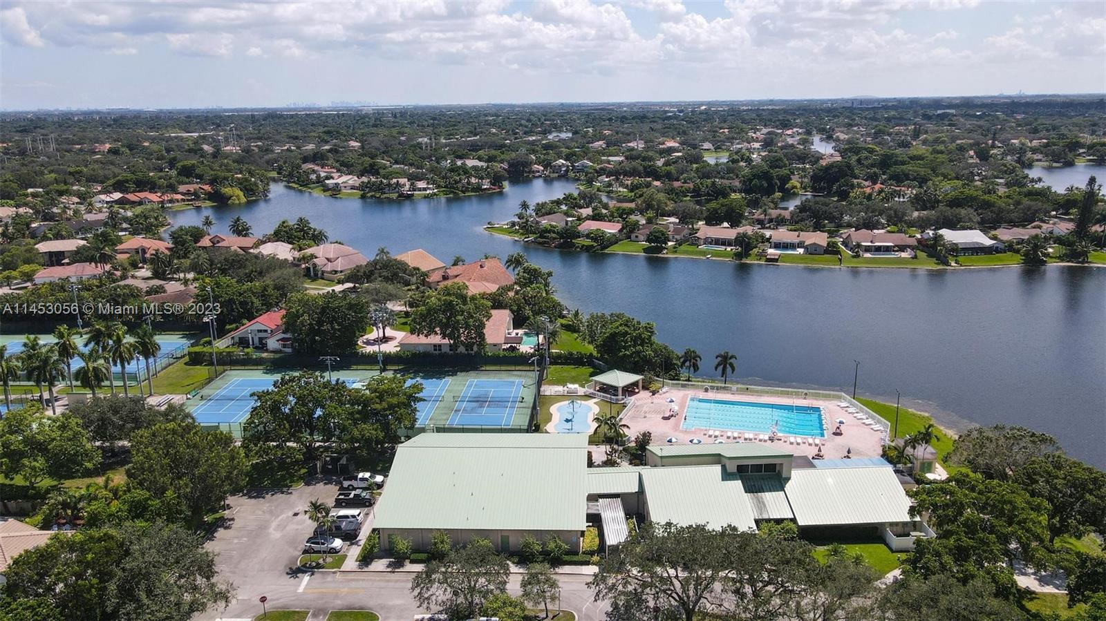 4175 Tree Top Road Cooper City, FL 33026 - Photo 36 of 39 an aerial view of a house with a lake view