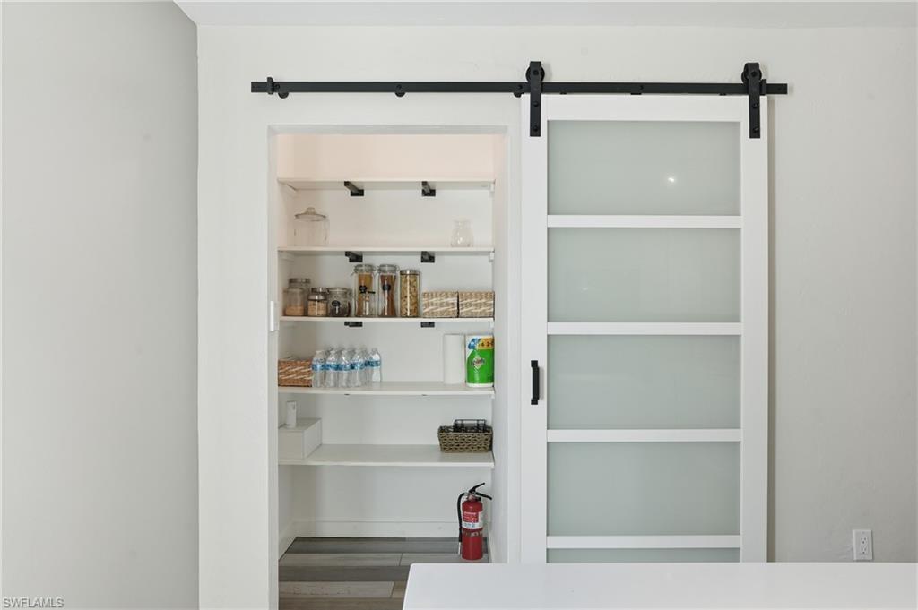 2828 Jackson Street, Unit H6 Fort Myers, FL 33901 - Photo 11 of 27 a view of walk in closet with empty racks