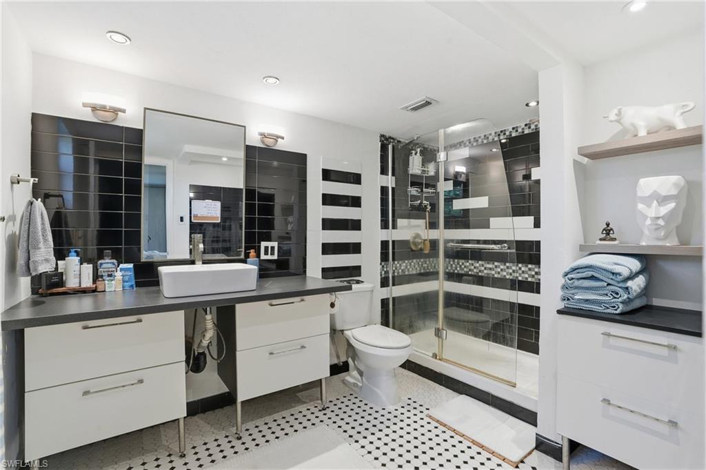 2828 Jackson Street, Unit H6 Fort Myers, FL 33901 - Photo 16 of 27 a kitchen with stainless steel appliances a sink and cabinets