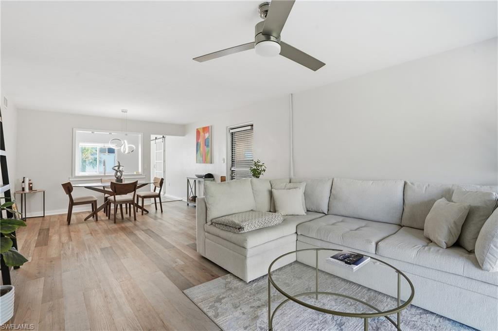 2828 Jackson Street, Unit H6 Fort Myers, FL 33901 - Photo 5 of 27 a living room with furniture and a wooden floor