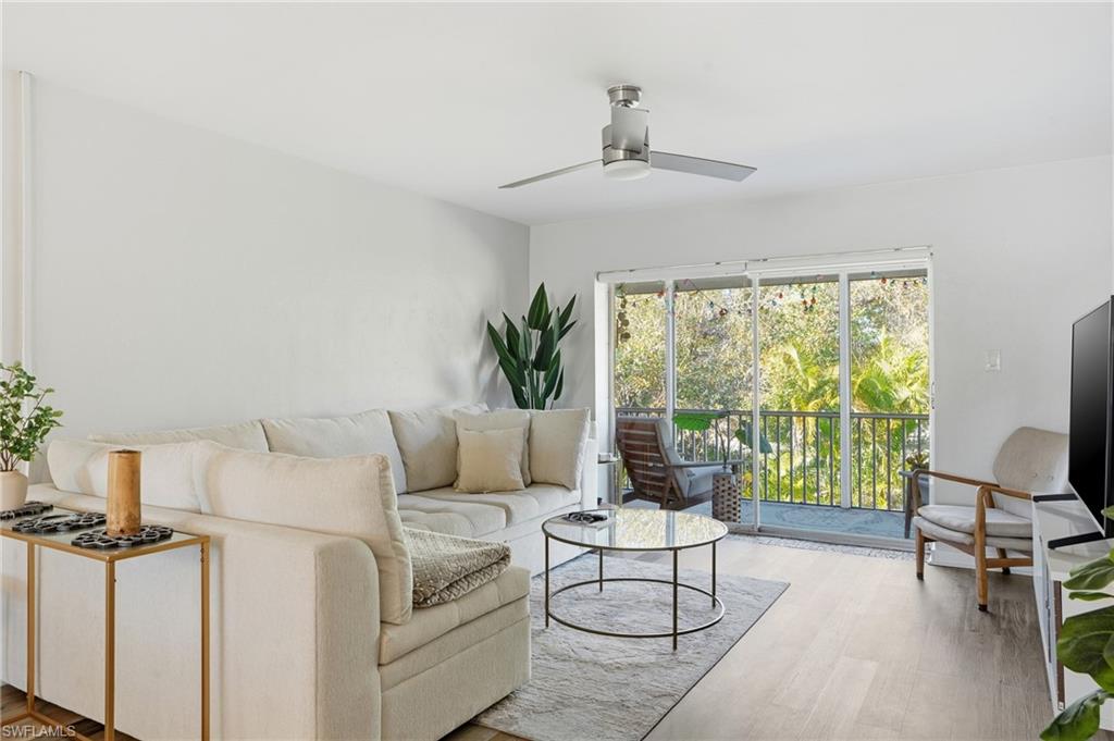 2828 Jackson Street, Unit H6 Fort Myers, FL 33901 - Photo 7 of 27 a living room with furniture and a large window