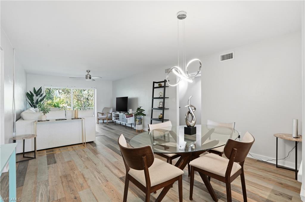 2828 Jackson Street, Unit H6 Fort Myers, FL 33901 - Photo 9 of 27 a dining room with furniture and window