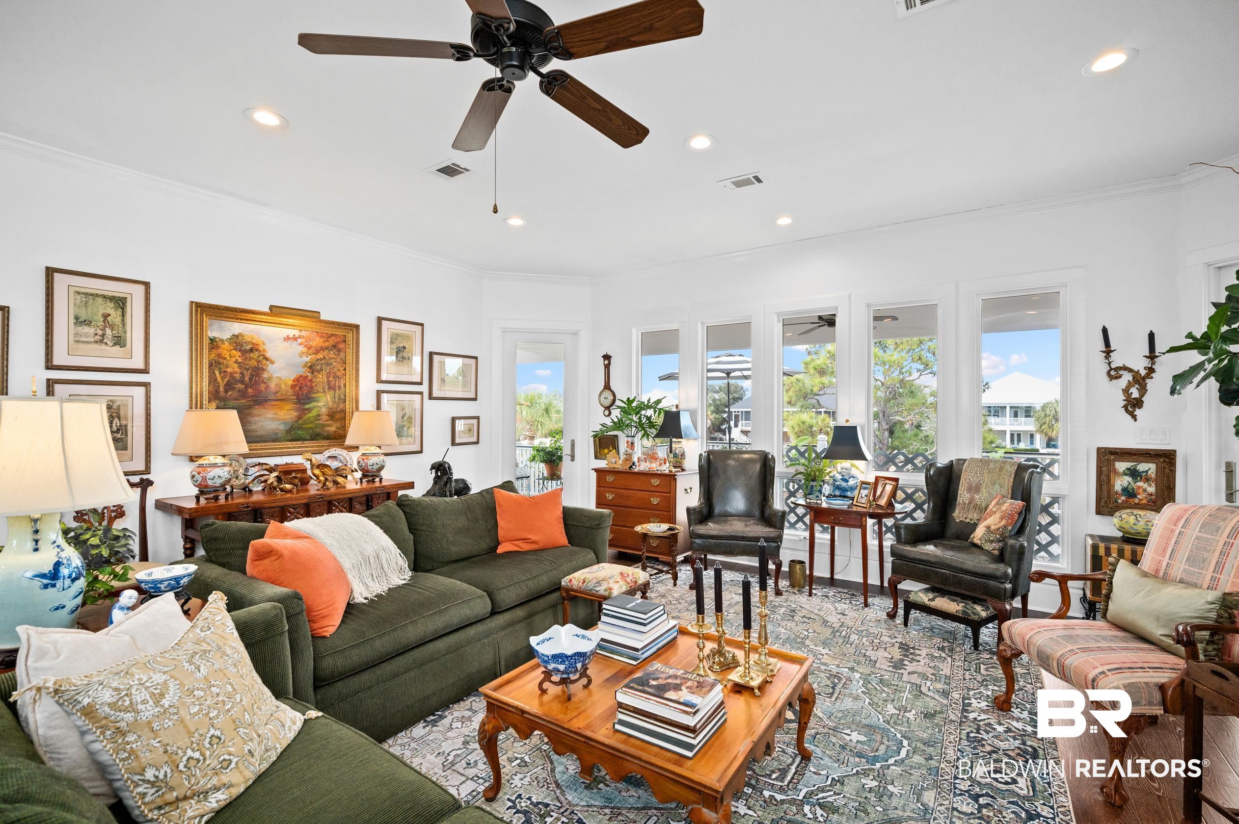31835 River Road Orange Beach, AL 36561 - Photo 10 of 55 Living room with crown molding and ceiling fan