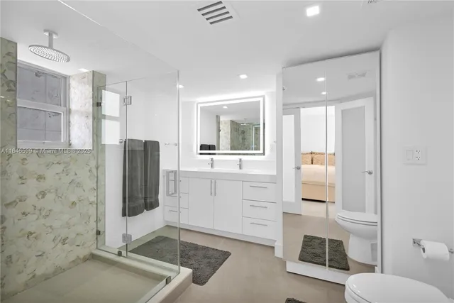 a bathroom with a shower and a sink
