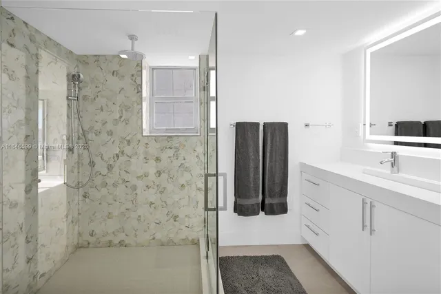 a bathroom with double sink and mirror