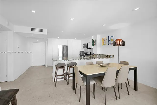 a view of a dining room with furniture