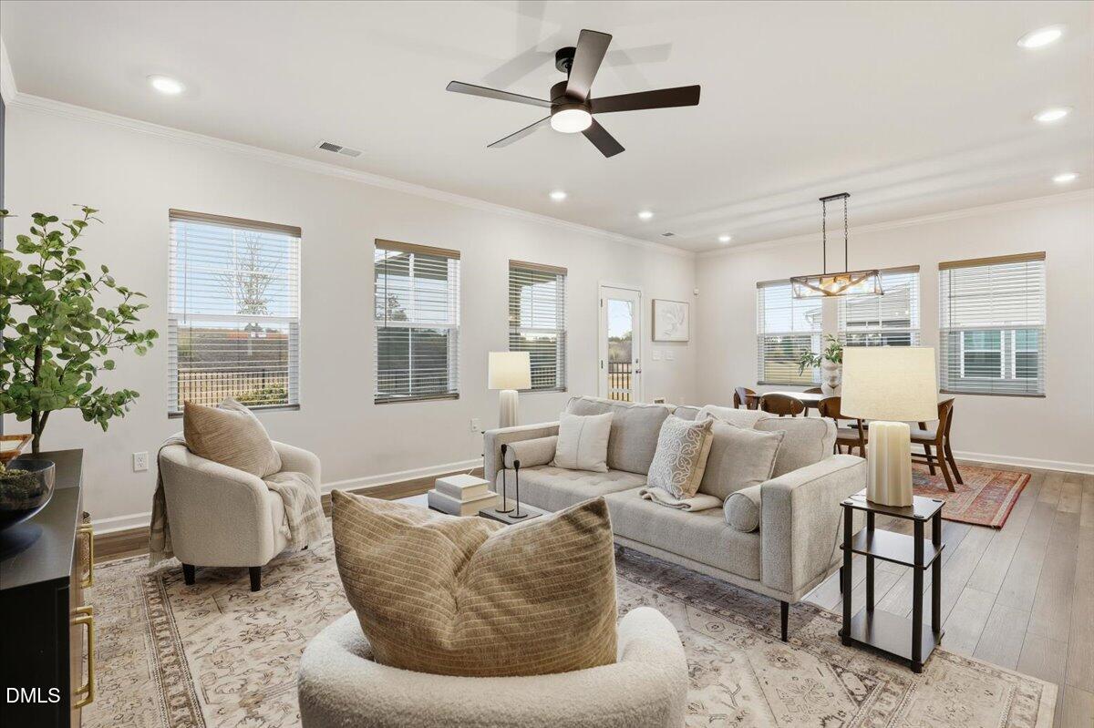 5052 Tura Street Raleigh, NC 27610 - Photo 12 of 47 a living room with furniture and a large window