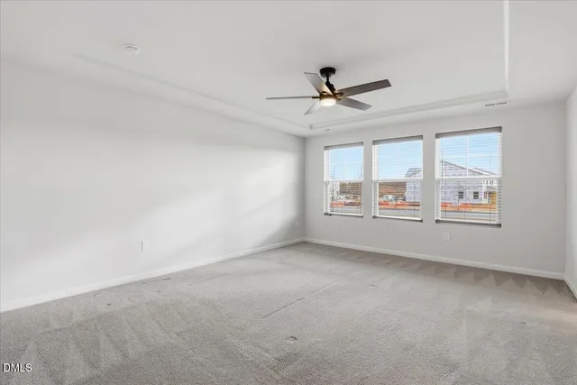 a living room with furniture kitchen view and a chandelier