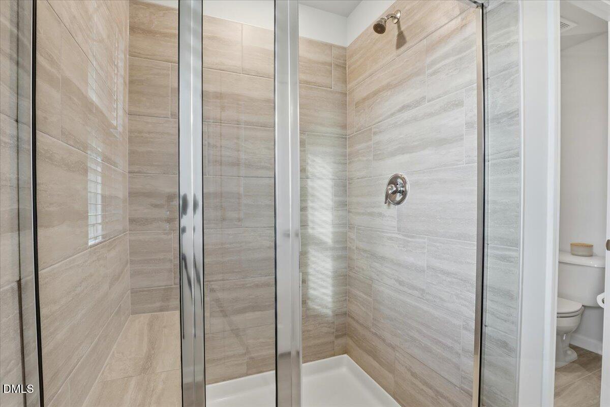 5052 Tura Street Raleigh, NC 27610 - Photo 20 of 47 a bathroom with a shower