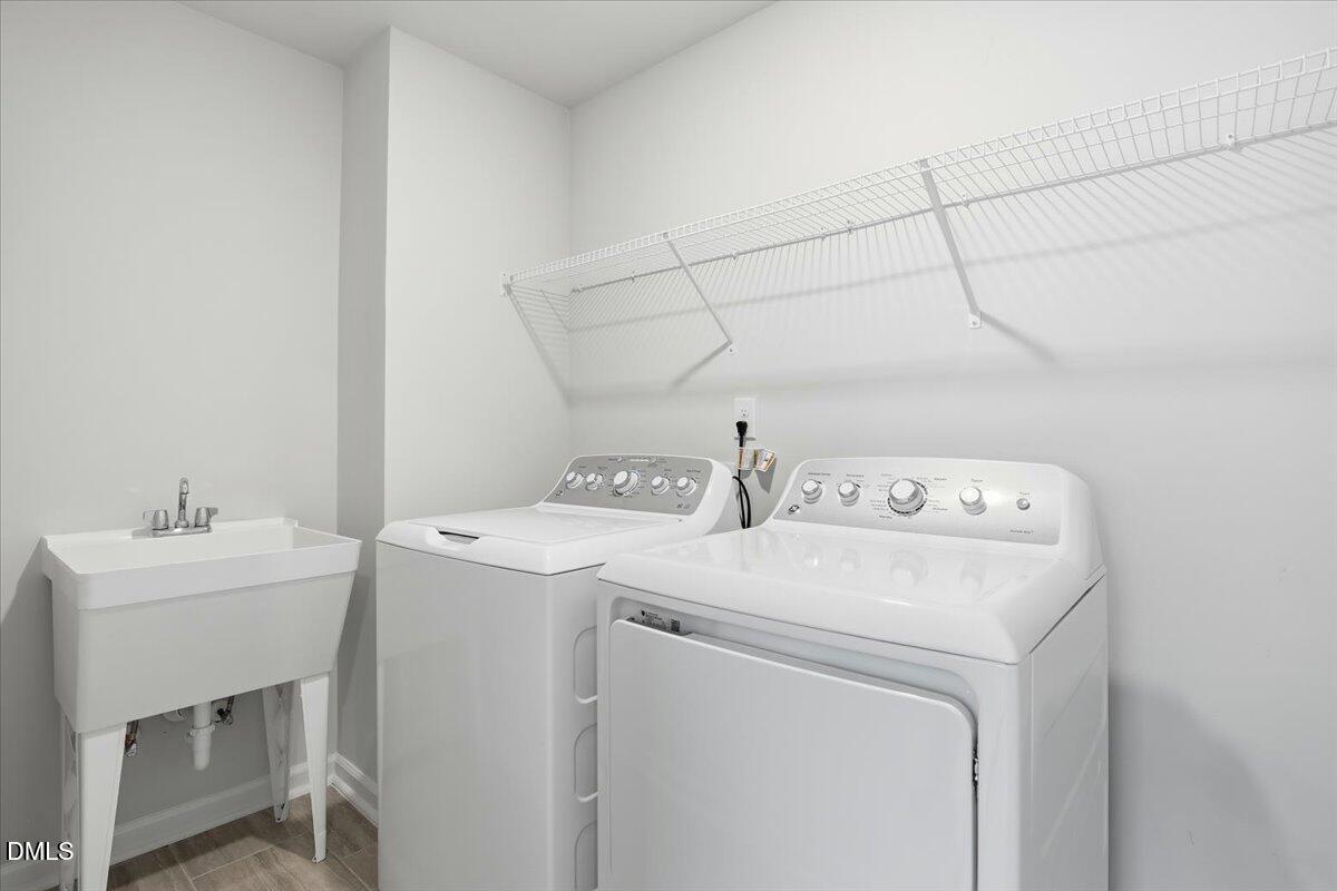 5052 Tura Street Raleigh, NC 27610 - Photo 21 of 47 a utility room with dryer and washer