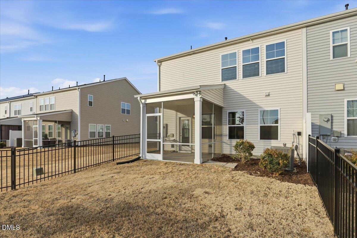 5052 Tura Street Raleigh, NC 27610 - Photo 26 of 47 a view of a house with a backyard