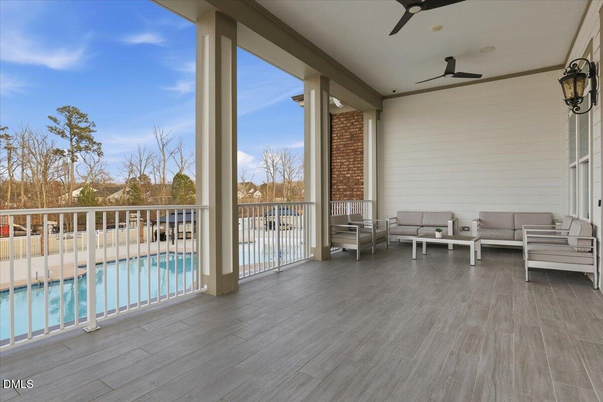 5052 Tura Street Raleigh, NC 27610 - Photo 30 of 47 a view of a balcony with chairs