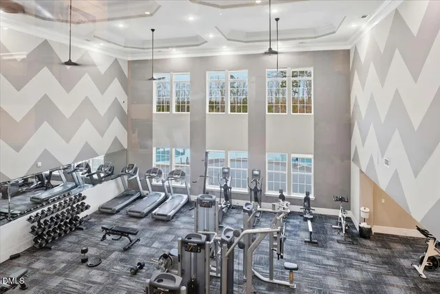 a view of a swimming pool with outdoor seating and a shower