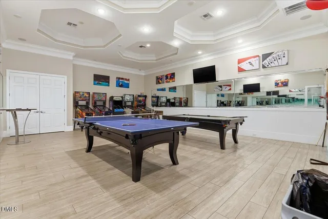 a view of a kitchen with kitchen island and a sink