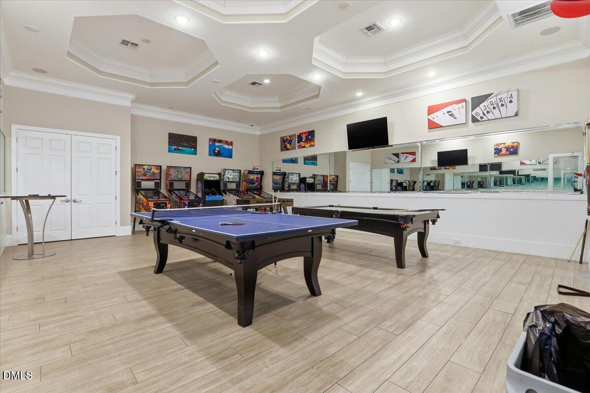 5052 Tura Street Raleigh, NC 27610 - Photo 35 of 47 a living room with furniture and a flat screen tv