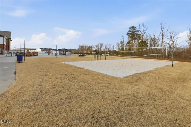 a view of a patio with table and chairs and potted plants