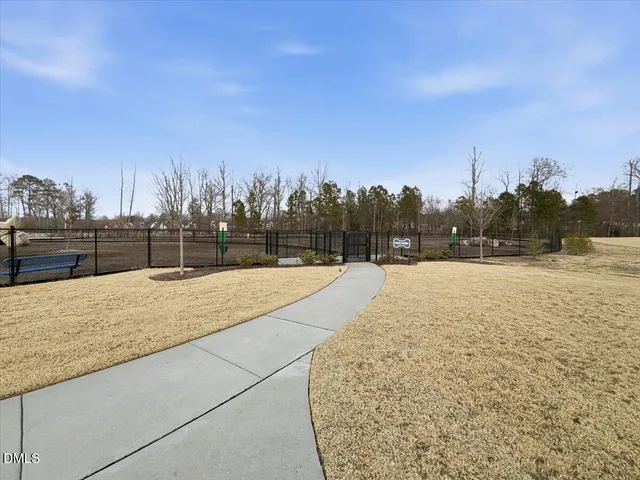 a view of a park with swings and slides
