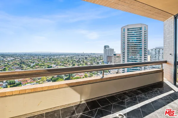 a view of a balcony with city view