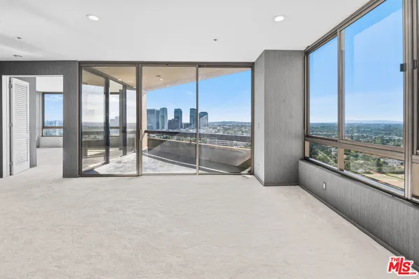 a view of an empty room with a large window
