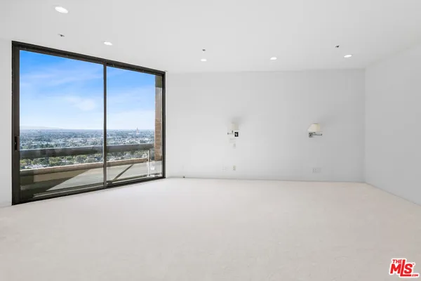 a view of an empty room with a balcony