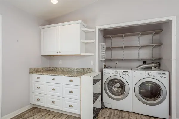 a utility room with cabinets