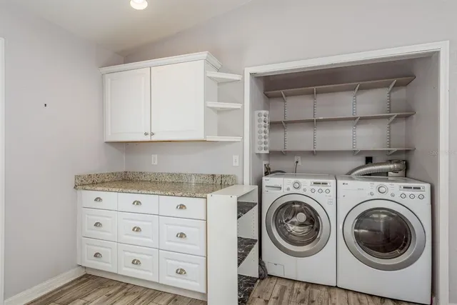 a utility room with cabinets