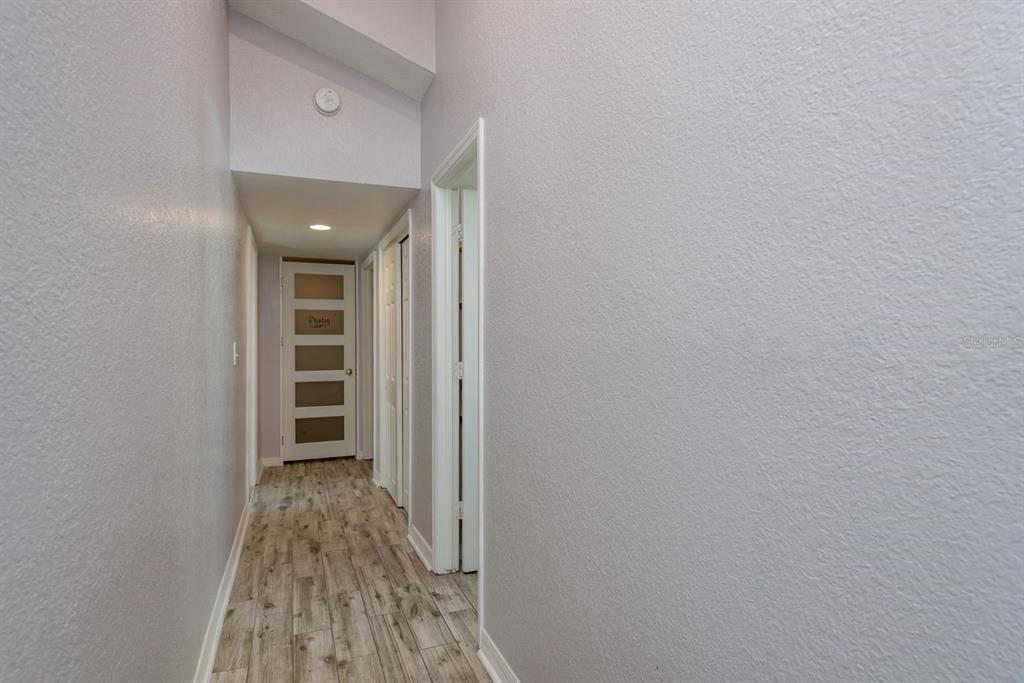 819 10th Street Southwest, Unit A Largo, FL 33770 - Photo 19 of 29 a view of a bedroom with wooden floor and closet