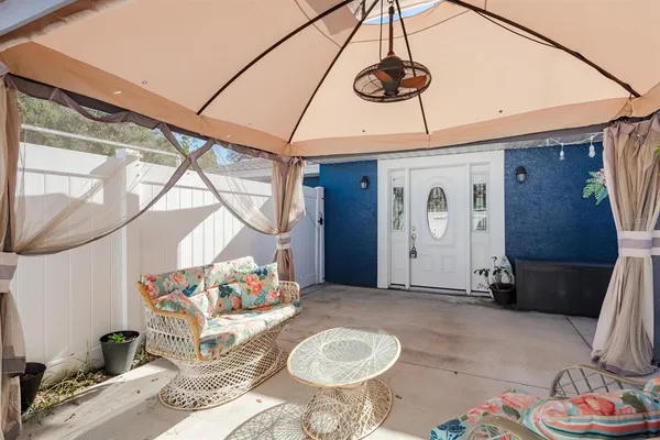a living room with furniture and a window