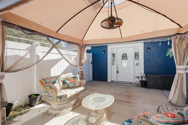 a living room with furniture and a window