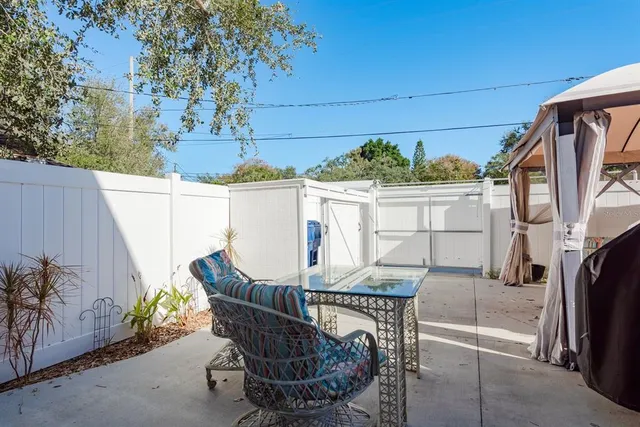 a view of balcony with furniture