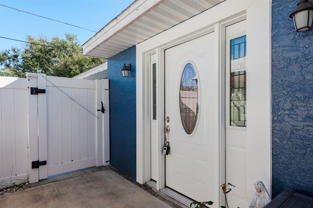 819 10th Street Southwest, Unit A Largo, FL 33770 - Photo 9 of 29 a front view of a house with a garden