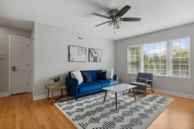 a living room with furniture and a rug