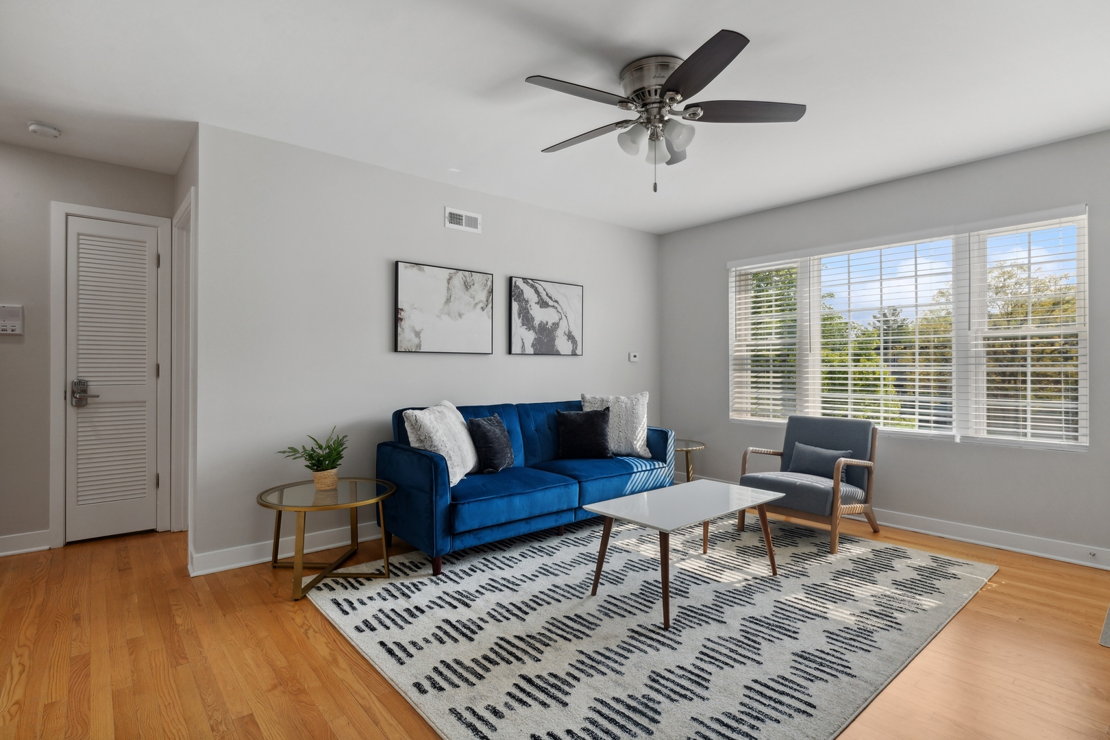 136 Ridge Avenue, Unit 2 Evanston, IL 60202 - Photo 4 of 12 a living room with furniture and a rug