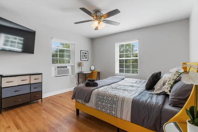 a bedroom with a bed and window