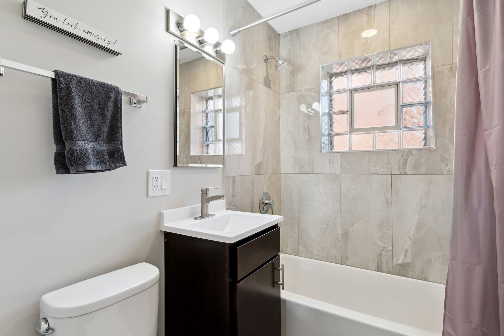 136 Ridge Avenue, Unit 2 Evanston, IL 60202 - Photo 9 of 12 a bathroom with a sink toilet and shower
