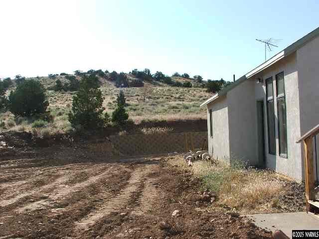 13990 North Red Rock Road Reno, NV 89508 - Photo 3 of 9 a view of a back yard of the house